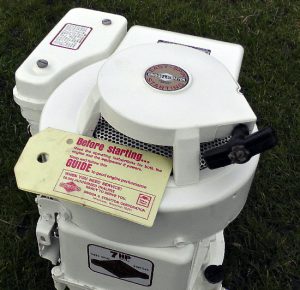 Briggs and Stratton engine with 1976 engine maintenance card